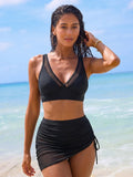 Ensemble bikini taille haute jupe drapée et voile mesh