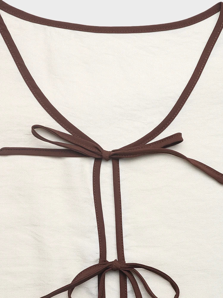 Ensemble top péplum sans manches à nœud et short